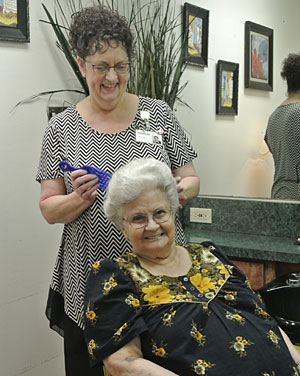 elderly womangetting her hair styled