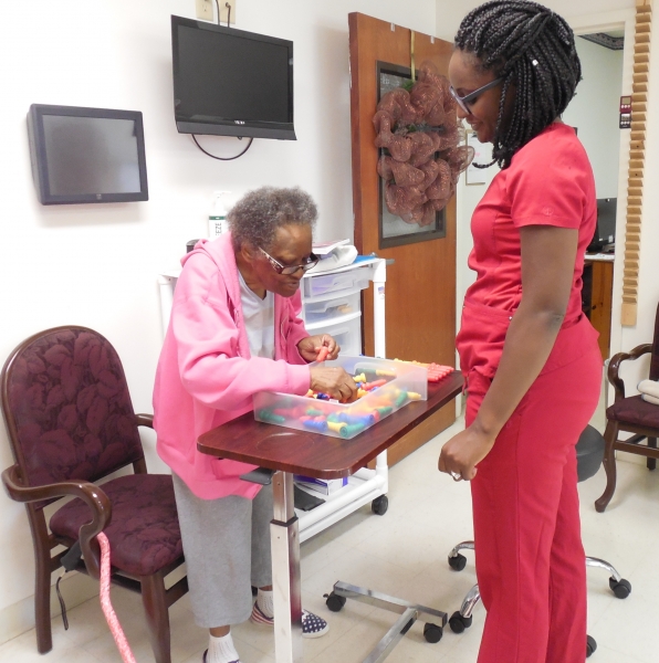 therapy team member working with a resident